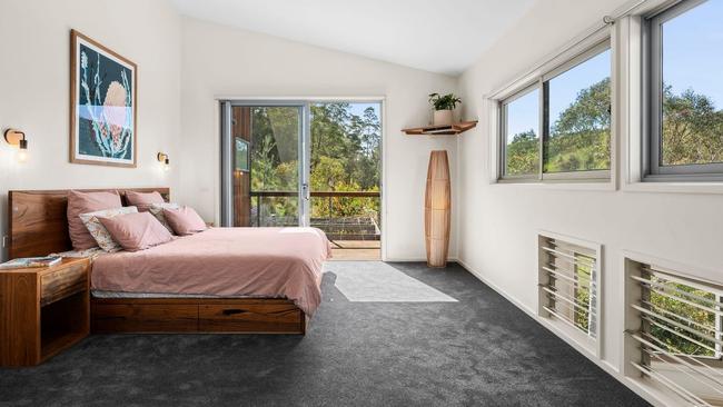 Wake up to treetop views in the main bedroom suite.