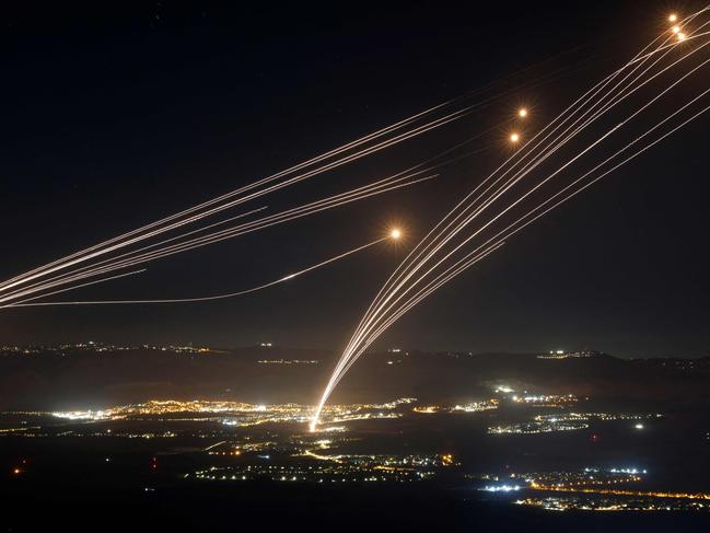 Rockets fired from southern Lebanon are intercepted by Israel's Iron Dome air defence system over the Upper Galilee region in northern Israel, on August 4, 2024. Picture: AFP