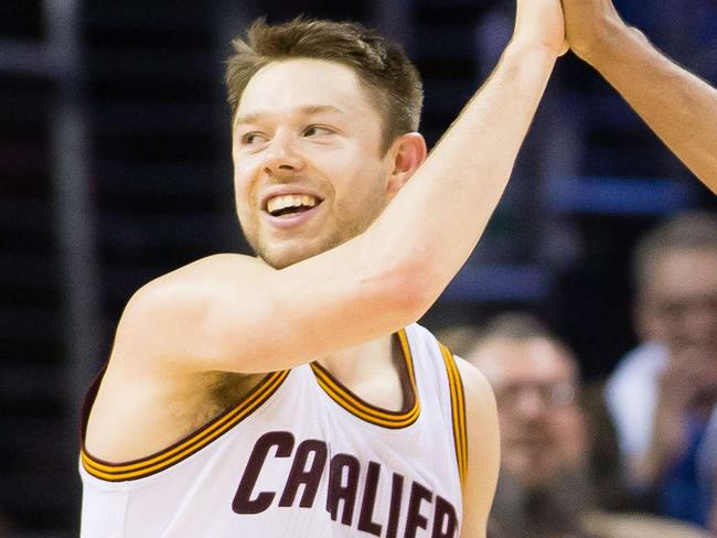 CLEVELAND, OH - APRIL 15: Matthew Dellavedova #8 celebrates with Shawn Marion #31 of the Cleveland Cavaliers during the final seconds of the game against the Washington Wizards at Quicken Loans Arena on April 15, 2014 in Cleveland, Ohio. The Cavaliers defeated the Wizards 113-108 in overtime. NOTE TO USER: User expressly acknowledges and agrees that, by downloading and or using this photograph, User is consenting to the terms and conditions of the Getty Images License Agreement. Jason Miller/Getty Images/AFP == FOR NEWSPAPERS, INTERNET, TELCOS & TELEVISION USE ONLY ==