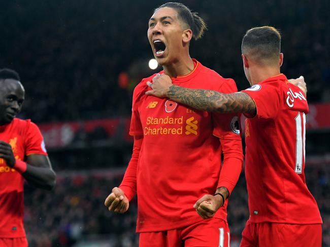 Liverpool's Roberto Firmino celebrates scoring his side's fourth goal.