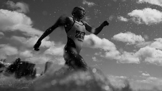 COOLANGATTA, AUSTRALIA - OCTOBER 13:  (EDITORS NOTE: Image has been converted to black and white.) Jemma Smith runs into the water during the 2019 Coolangatta Gold on October 13, 2019 in Coolangatta, Australia. (Photo by Chris Hyde/Getty Images)