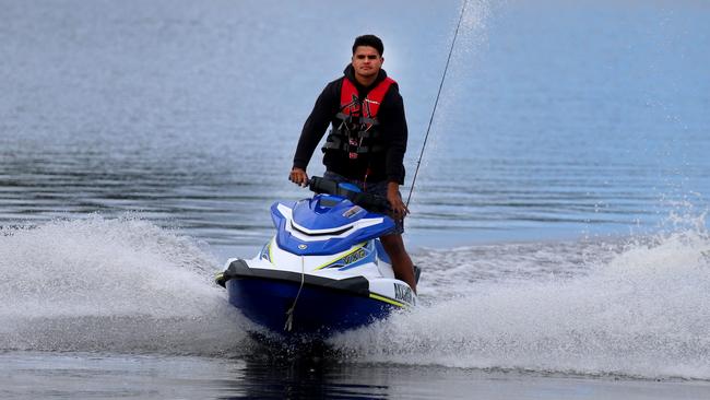 NRL player Latrell Mitchell arrives back from fishing from his jet ski on the Manning River at Taree. Pic Peter Lorimer