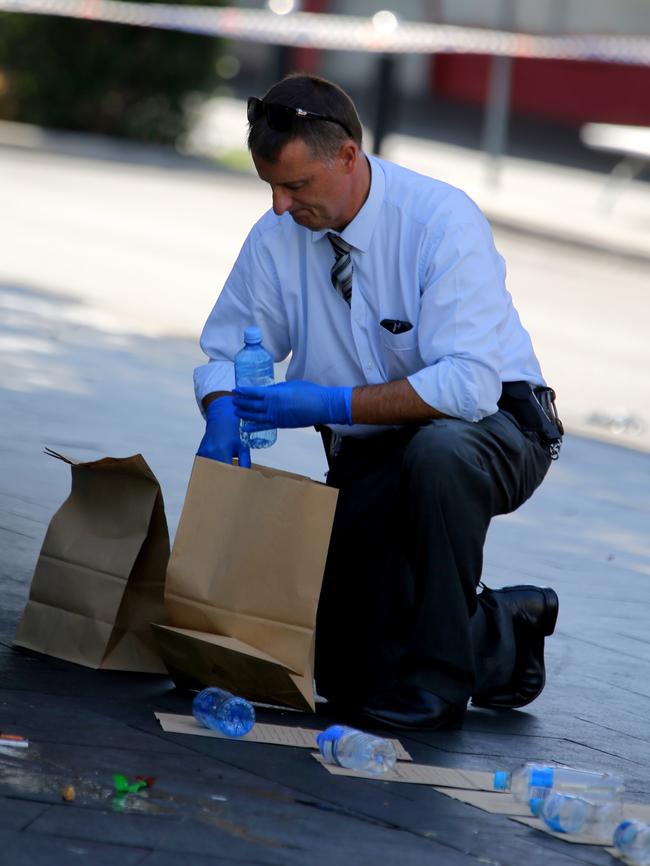 Officer gathers evidence. Pictures: John Grainger