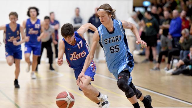 Sturt rising star Bailey Anderson is pursued by Central Districts’ Riley McDonald during the under-16 grand final at St Clair. Picture: Naomi Jellicoe