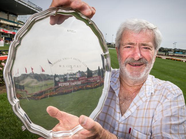 Chris Biggins with the 1992 Cox Plate won by Super impose. Chris and owners are donating the trophy to be auctioned off to raise money for bushfire victims. Picture: Jake Nowakowski