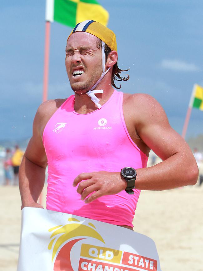 Tanyn Lyndon crosses the line first in the ironman race at the Queensland State surf life saving championships. Picture: Harvpix