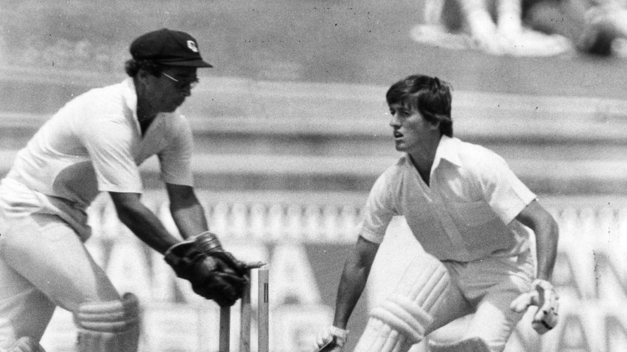 Queensland wicketkeeper Ray Phillips (l) takes the bails off as SA batsman Don O'Connor slips in safely.