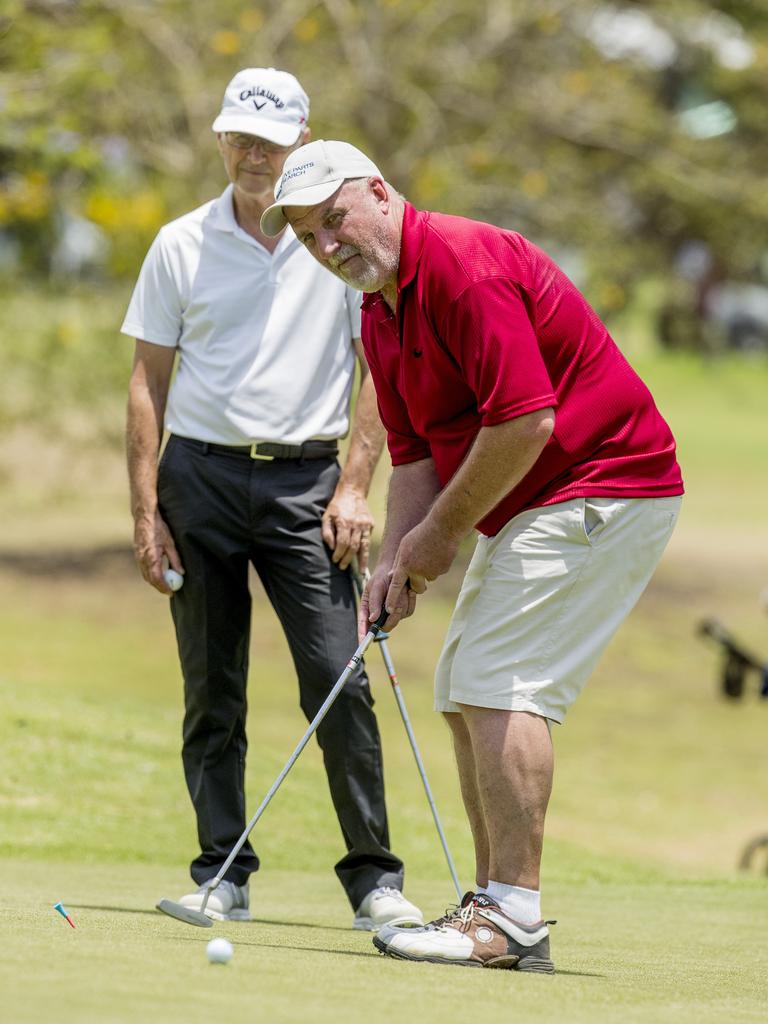 Kevin Fellows and Darryl Carr (red) playing at the reopened Helensvale Golf Club. Picture: Jerad Williams