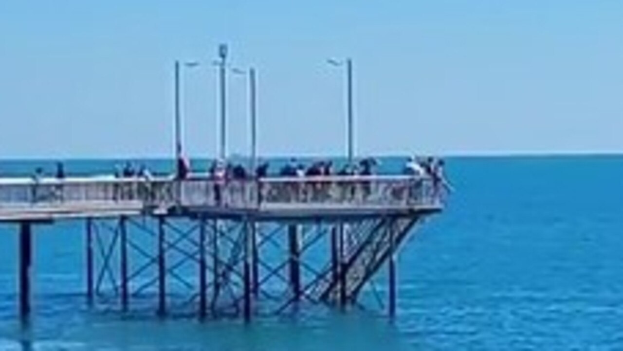 Beachgoers “panicked” when a young man jumped into the water. Picture: Nigel Thompson