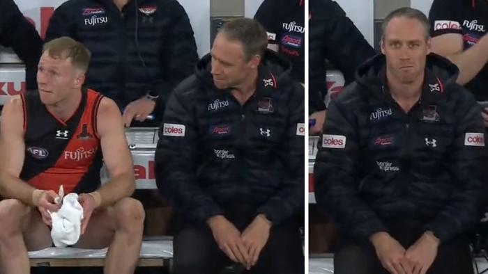 Nick Hind appears to ignore Ben Rutten on the bench during Essendon's win over North Melbourne.