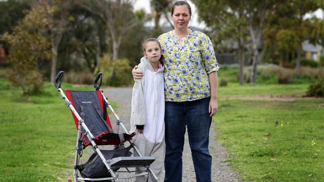 Hannah Scott, 10, and her mother Sarah. Hannah sufferes from Tetralogy of Fallot and occasionally needs the assistance stroller. Picture: Bianca De Marchi