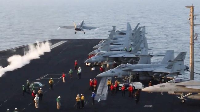 This image taken from video provided by the U.S. Navy shows an aircraft launching from the USS Harry S. Truman in the Red Sea before airstrikes in Sanaa, Yemen, Saturday, March 15, 2025. (U.S. Navy via AP)