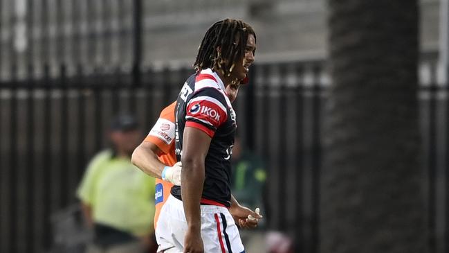 Young is helped from the field after the Injury. NRL PHOTOS