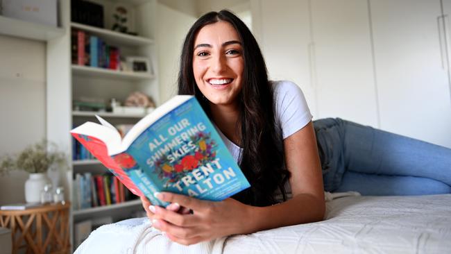 Faith Elhelou at home with her collection of books. Picture: Jeremy Piper