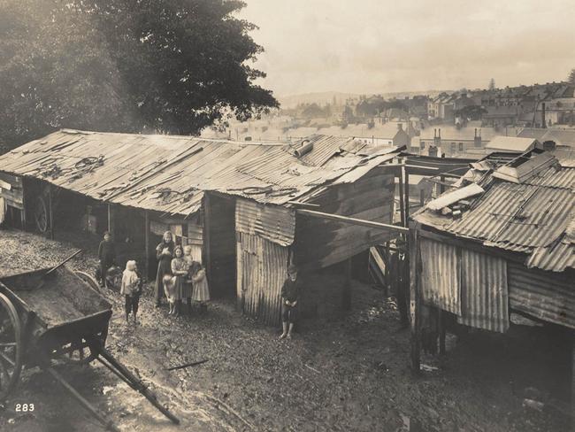 Areas of The Rocks were barricaded off and its slums were demolished. Picture: State Library of NSW