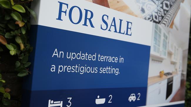 A “for sale” sign on a house in Sydney. Picture: Bloomberg 