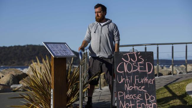 Jacob Cooke, 34, outside his restaurant in Batemans Bay, NSW. After a busy seven weeks since reopening the restaurant is now closed again, with only three staff working, after 15 of his staff were placed in self-isolation. Picture: Sean Davey.