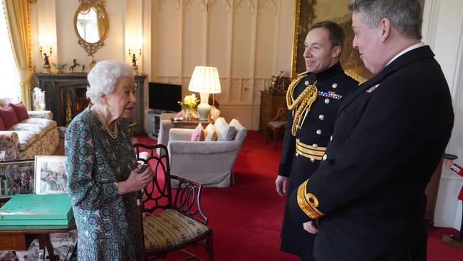 When meeting outgoing Defence Service Secretaries Rear Admiral James Macleod (right) and incoming Defence Service Secretaries Major General Eldon Millar, the Queen quipped: ‘Well as you can see, I can’t move.’ Picture: Steve Parsons/AFP