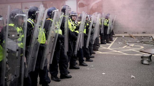 Riot police create a barricade outside the Holiday Inn Express in Rotherham. Picture: Getty Images