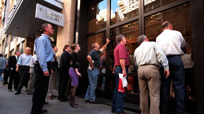 Investors checking the ASX board in Sydney in the early 2000s.