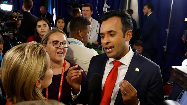 Vivek Ramaswamy speaks to a reporter in the Spin Room following the first Republican presidential primary debate in August. Picture: AFP