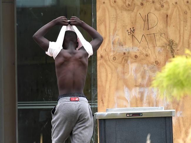 A youth at the trashed Ecoville Community Centre in Tarneit. Picture: Nicole Garmston