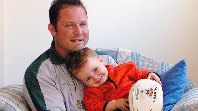 Troy Pezet, who also played for Wyong rugby league, with son Jonah when 16 months old.