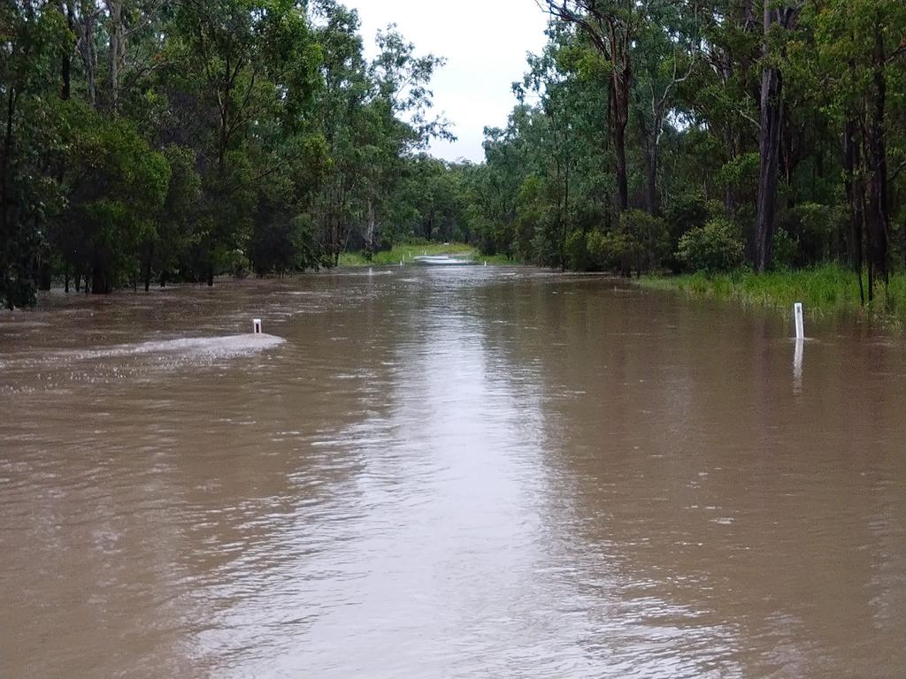 Photos of 1m of water over Beresford Rd Boompa on the Biggenden/Maryborough Rd. Picture: Hayden Beresford