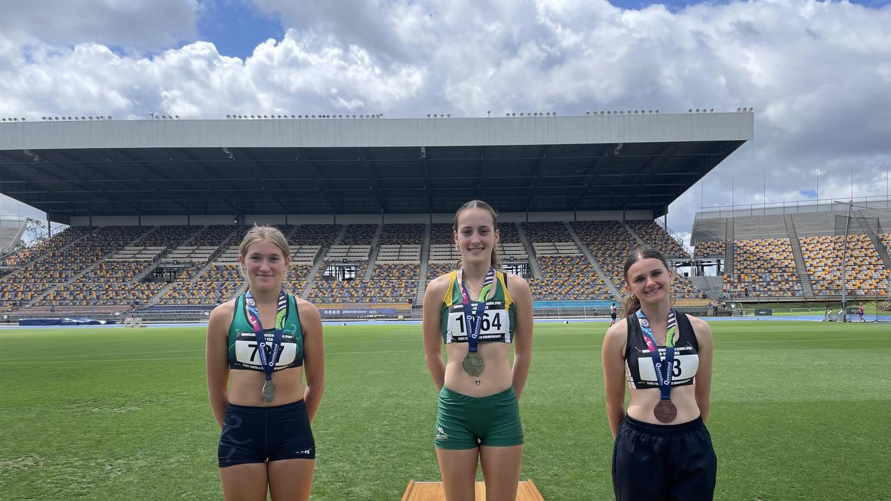 Smiling medallists from the track and field championships.