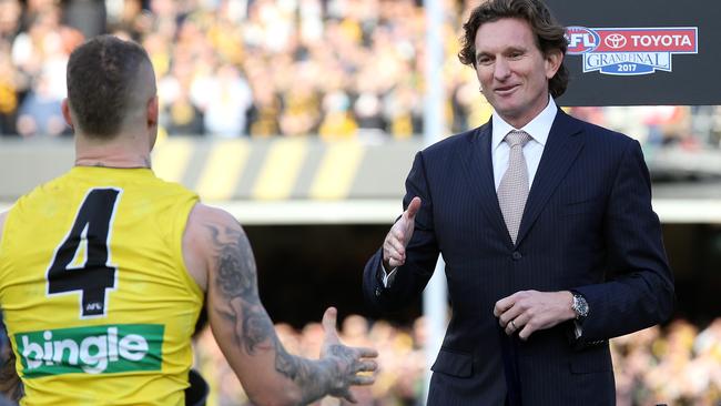 James Hird presents Dustin Martin with his Norm Smith Medal. Picture: Michael Klein