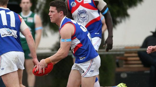 Billy Hogan gets a kick for North Heidelberg. Picture: Hamish Blair