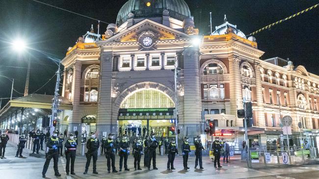 Police guard Flinders Street station in Melbourne amid an anti-lockdown protest. Picture: Wayne Taylor