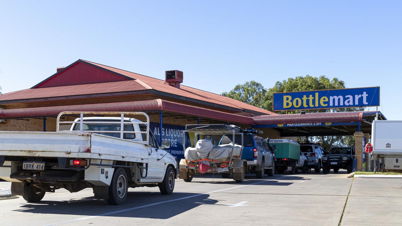 Come 12pm, significant lines form at bottle shops in Carnarvon. Picture: Jon Gellweiler Picture: Jon Gellweiler/news.com.au