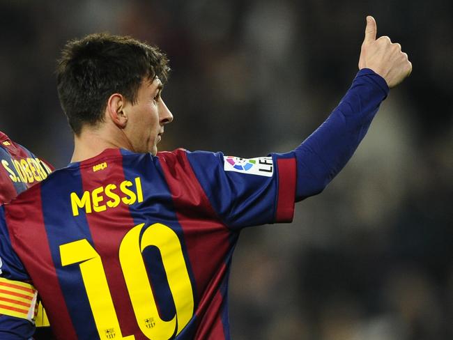 FC Barcelona's Lionel Messi, from Argentina, gestures after scoring against Elche during a round of 16 first leg Copa del Rey soccer match at the Camp Nou stadium in Barcelona, Spain, Thursday, Jan. 8, 2015. (AP Photo/Manu Fernandez)