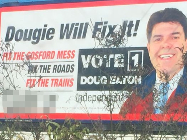 Doug Eaton’s big election billboard on the Pacific Highway at Ourimbah was vandalised last month.