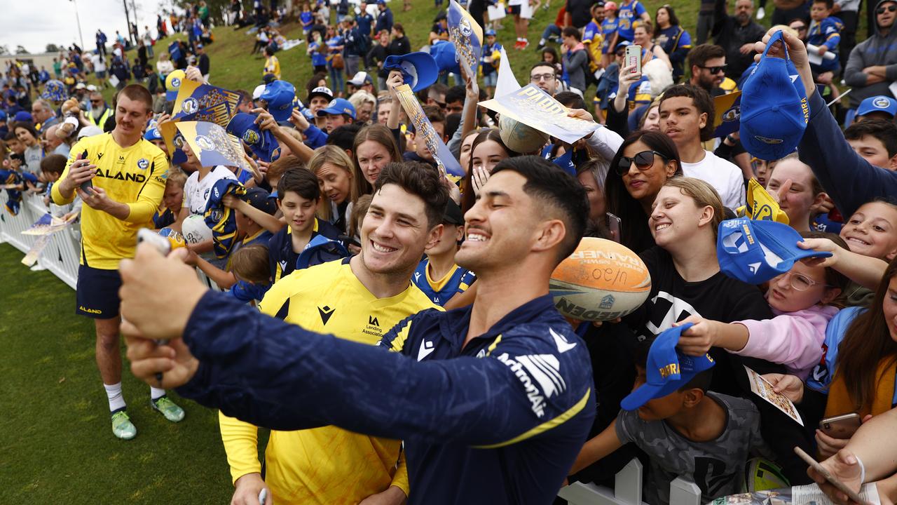 Moses and teammate Dylan Brown were surrounded by eager fans. Picture: Richard Dobson