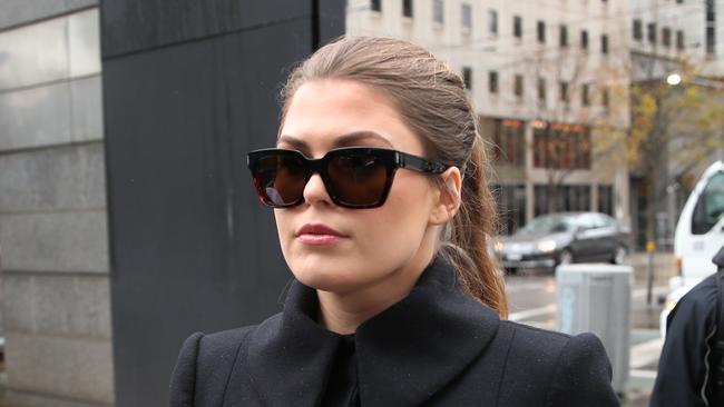 Belle Gibson arrives at the Federal Court in Melbourne, Thursday, June 20, 2019. Cancer con artist Belle Gibson is facing court over failure to pay a $410,000 penalty. (AAP Image/David Crosling) NO ARCHIVING