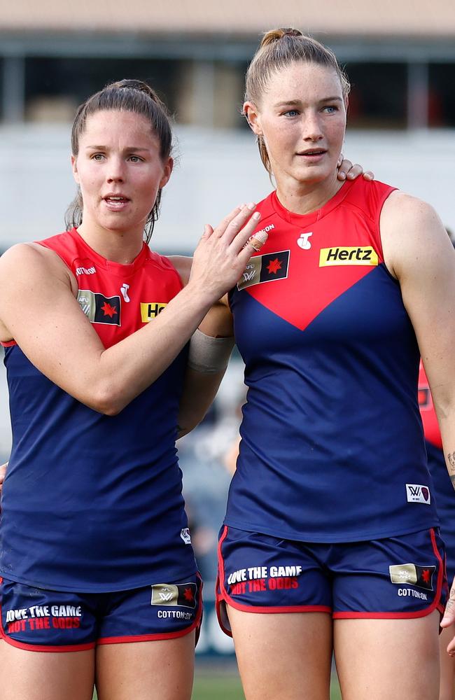 Tayla Harris with Demons captain Kate Hore after the Demons’ shock finals loss to North Melbourne. Picture: Michael Willson/AFL Photos via Getty Images