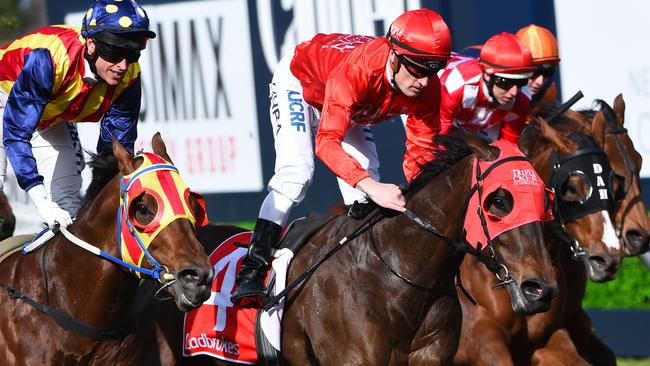 Mark Zahra rates Redzel perfectly to hold out the fast-finishing Under The Louvre (left) in The Heath Stakes. Picture: Getty Images