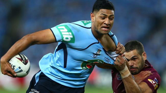 Daniel Tupou is tackled by Greg Inglis during State of Origin I at ANZ Stadium. Picture: Mark Kolbe/Getty Images