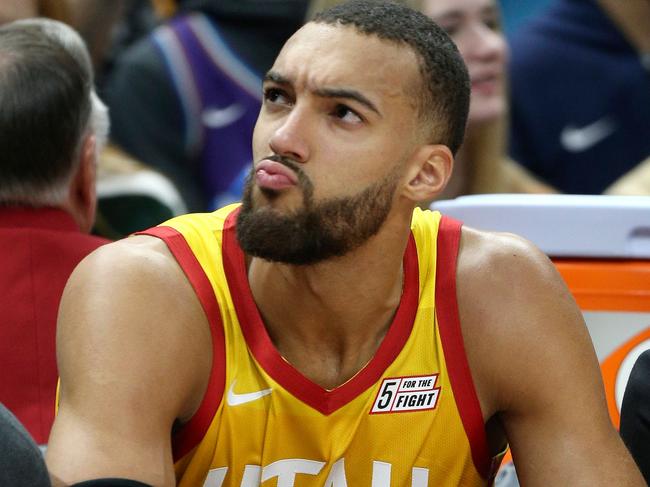 (FILES) In this file photo taken on December 04, 2019 Utah Jazz center Rudy Gobert looks at the fans in the stands during an NAB game against the Los Angeles Lakers in Salt Lake City, Utah. - The NBA will suspend play starting on Thursday after a Utah Jazz player preliminarily tested positive for the new coronavirus, the league said March 11, 2020. The test result was reported shortly before Utah's game against the Thunder in Oklahoma City was to begin, and that game was abruptly postponed. The NBA did not name the player who had tested positive, but several US media outlets reported it was French defensive standout Rudy Gobert, who was listed first as questionable for the game and then as out with illness. (Photo by GEORGE FREY / AFP)