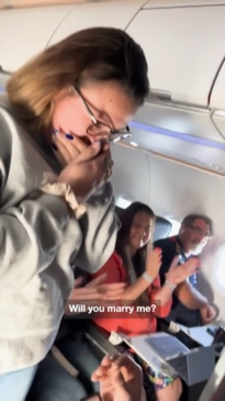 Emotional moment man proposes  on a flight to Bali