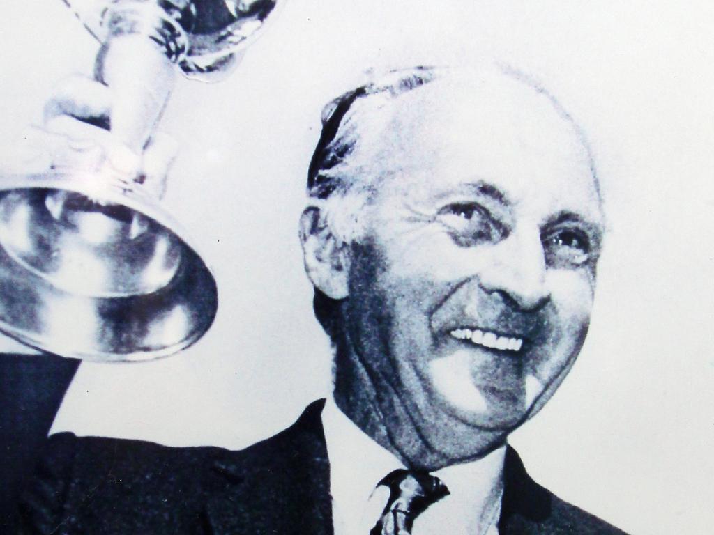 RECOPY For Sun Tas. 40th anniversary of Melbourne Cup win by Piping Lane ridden by John Letts. Copy picture of R.W. Trinder 1902-1994 with the cup.