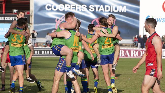 Golden Grove players celebrate after winning the Adelaide Footy League division three flag. Picture: Emma Brasier