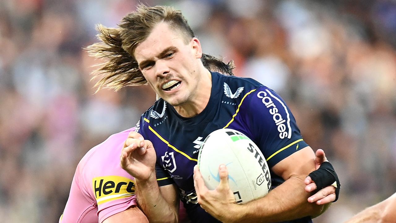 BRISBANE, AUSTRALIA – SEPTEMBER 25: Ryan Papenhuyzen of the Storm is tackled during the NRL Preliminary Final match between the Melbourne Storm and the Penrith Panthers at Suncorp Stadium on September 25, 2021 in Brisbane, Australia. (Photo by Bradley Kanaris/Getty Images)