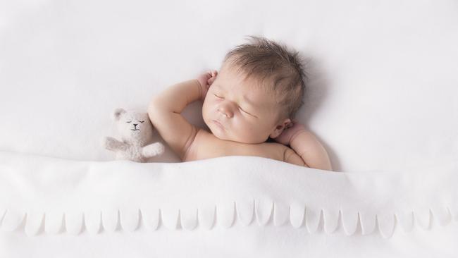 Baby Harry in a very natural pose, with a small prop. Picture: Bee Cherished Photography