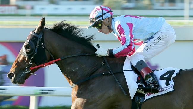 Michael Cahill steers Akavoroun to victory in the Tattersall’s Mile. Picture: Mark Cranitch