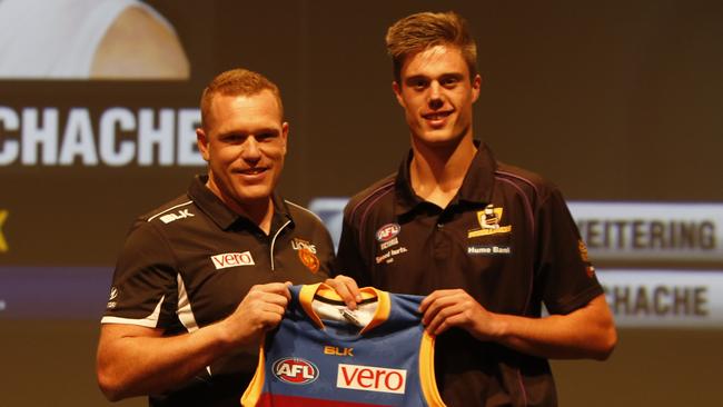 Former Brisbane Lions coach Justin Leppitsch with 2015 national draft pick 2 Josh Schache.