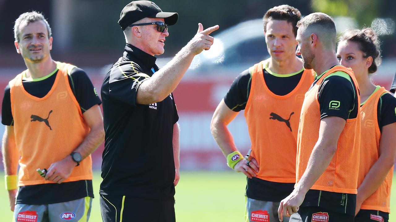 ‘We’ve been getting crucified all day ...’ Tigers coach Damien Hardwick chats with the umpires at three quarter time. Pic: Getty Images