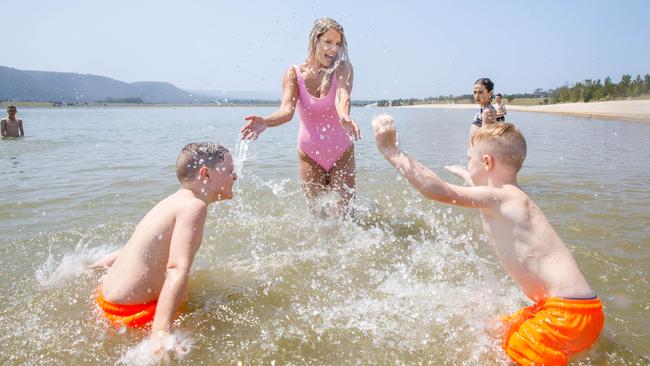 Emma Williams and her children, Cohen, 7, and Phoenix, 5, enjoy a splash at “Pondi”, in Penrith, in December 2023. Picture: Max Mason-Hubers